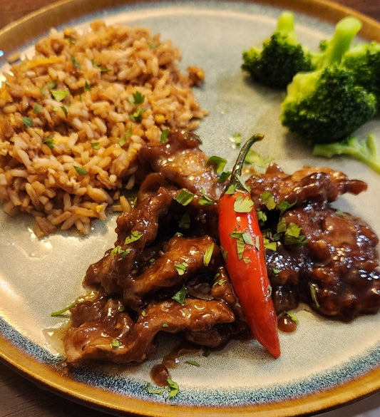 Crispy Mongolian beef made with Diamond R flank steak in a sweet and spicy sauce, garnished with cilantro