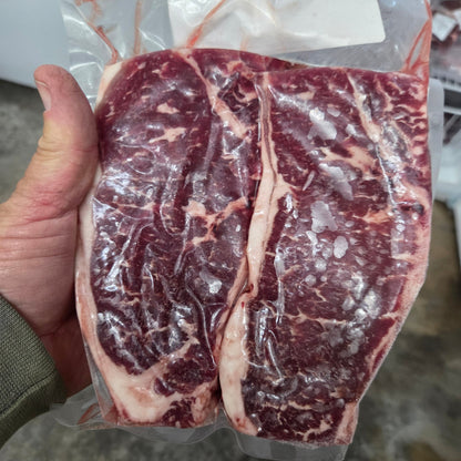 Vacuum-sealed New York (KC) strip steaks from a Diamond R Cattle eighth share beef bundle