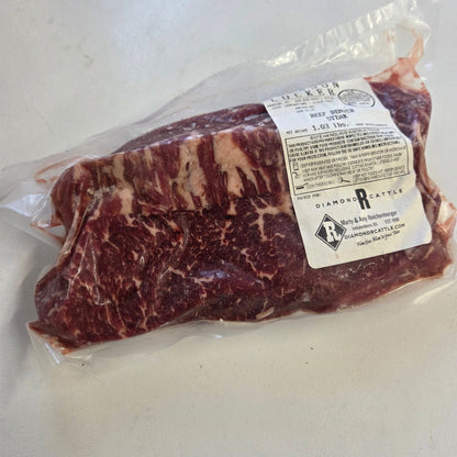 Vacuum-sealed Denver steaks with locker label from a Diamond R Cattle eighth share beef bundle